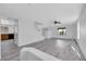 Spacious living room with hardwood floors, a staircase, and access to other areas of the home at 3644 Shanagolden St, Las Vegas, NV 89129