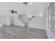 Inviting living room showcases hardwood floors, a staircase, and seamless access to dining at 3644 Shanagolden St, Las Vegas, NV 89129