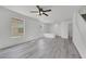 Comfortable living room boasts hardwood floors, neutral walls, and a ceiling fan for added comfort at 3644 Shanagolden St, Las Vegas, NV 89129