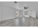 Cozy living room with hardwood floors, neutral walls, and abundant natural light from multiple windows at 3644 Shanagolden St, Las Vegas, NV 89129