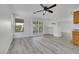 Bright and airy living room with hardwood floors, window views, and easy access to kitchen at 3644 Shanagolden St, Las Vegas, NV 89129