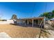 This home features a backyard with stone landscaping and a covered patio at 3700 Hickey Ave, North Las Vegas, NV 89030
