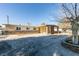 Single-story home with stone accents, a covered front porch, and low-maintenance landscaping at 3700 Hickey Ave, North Las Vegas, NV 89030
