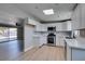 Well-lit kitchen with new appliances, white cabinets and plenty of counter space at 3700 Hickey Ave, North Las Vegas, NV 89030