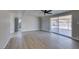 Open living area showcasing vinyl plank flooring, fresh paint, and sliding glass doors to the backyard at 3700 Hickey Ave, North Las Vegas, NV 89030