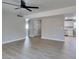 Bright living room with light wood floors, ceiling fan, and neutral paint, creating a modern feel at 3700 Hickey Ave, North Las Vegas, NV 89030