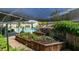 Outdoor vegetable garden and pool provide great backyard space to enjoy at 386 Summer Creek Ct, Henderson, NV 89002