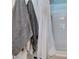 Clean, tiled bathroom features gray towels and a shower with a white curtain at 386 Summer Creek Ct, Henderson, NV 89002