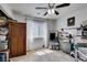 Bedroom featuring tile floor, ceiling fan and natural light at 386 Summer Creek Ct, Henderson, NV 89002