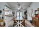 Bright dining room with large wood table and access to outdoor patio at 386 Summer Creek Ct, Henderson, NV 89002