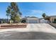 Charming single-story home featuring desert landscaping, a two-car garage, and a welcoming entryway at 386 Summer Creek Ct, Henderson, NV 89002