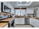 Bright kitchen featuring wood countertops, stainless steel appliances, and white cabinetry at 386 Summer Creek Ct, Henderson, NV 89002