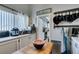 Functional kitchenette with white cabinets and countertops, featuring modern appliances at 386 Summer Creek Ct, Henderson, NV 89002
