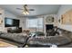 Living room featuring a large television and comfortable leather couch at 386 Summer Creek Ct, Henderson, NV 89002