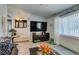 Living room featuring a large television and neutral decor at 386 Summer Creek Ct, Henderson, NV 89002