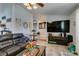 Living room features a large television, rustic decor, and comfortable seating at 386 Summer Creek Ct, Henderson, NV 89002