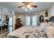 Large bedroom with a sliding door, ceiling fan, and access to an outdoor patio at 386 Summer Creek Ct, Henderson, NV 89002