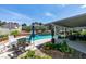 Outdoor pool area with patio, landscaping, seating, and blue skies above at 386 Summer Creek Ct, Henderson, NV 89002