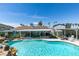 Inviting pool and patio area surrounded by lush landscaping and desert scenery at 386 Summer Creek Ct, Henderson, NV 89002