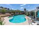 Beautiful backyard pool with a water feature, seating, and lush landscaping at 386 Summer Creek Ct, Henderson, NV 89002