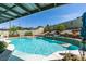 Sparkling swimming pool with waterfall feature and beautifully landscaped surroundings at 386 Summer Creek Ct, Henderson, NV 89002