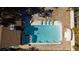 Aerial view highlighting a sparkling swimming pool with an attached spa, surrounded by lounge chairs in a private backyard at 4012 Vegas Dr, Las Vegas, NV 89108