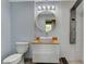 Stylish bathroom with a vessel sink, round mirror, elegant fixtures, and modern shower system at 4012 Vegas Dr, Las Vegas, NV 89108