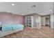 Bedroom featuring a large bed, wardrobe, wood floors and ensuite bathroom at 4012 Vegas Dr, Las Vegas, NV 89108