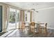 Bright dining space featuring modern pendant lighting and a large glass door to the yard at 4012 Vegas Dr, Las Vegas, NV 89108