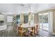Dining area with pendant lights and hardwood floors; glass door leads to outside at 4012 Vegas Dr, Las Vegas, NV 89108