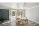 Dining area with modern lighting and hardwood floors; glass door leads to outside at 4012 Vegas Dr, Las Vegas, NV 89108