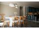 Dining area open to kitchen with modern lighting, wood floors, and stylish countertops at 4012 Vegas Dr, Las Vegas, NV 89108