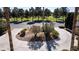 Circular driveway featuring desert landscaping, offering an inviting entrance with palm trees and shrubbery at 4012 Vegas Dr, Las Vegas, NV 89108