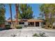 Charming single-story home with lush greenery and a well-maintained front yard at 4012 Vegas Dr, Las Vegas, NV 89108