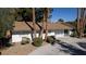 Charming single-story home with mature palm trees and desert landscaping at 4012 Vegas Dr, Las Vegas, NV 89108
