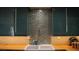 Close up of kitchen features butcher block countertop and a stylish farm sink at 4012 Vegas Dr, Las Vegas, NV 89108