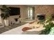 Bright living room features a cozy fireplace, large TV, and plush rug at 4012 Vegas Dr, Las Vegas, NV 89108