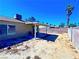 This backyard features a covered patio and block wall providing privacy at 4016 Calle Paula, Las Vegas, NV 89103