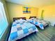 Cozy bedroom with two beds and warm colors at 4016 Calle Paula, Las Vegas, NV 89103