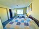 Shared bedroom with gray floors, two beds, lamps, closet and natural light at 4016 Calle Paula, Las Vegas, NV 89103