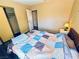 Bedroom with gray floors, closet, bedside lamp and a comfortable quilt at 4016 Calle Paula, Las Vegas, NV 89103
