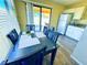 Bright dining area with sliding glass door, wood-look floors and convenient access to kitchen at 4016 Calle Paula, Las Vegas, NV 89103