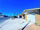 Charming single-story home featuring an attached garage and well-lit driveway at 4016 Calle Paula, Las Vegas, NV 89103