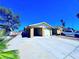 Exterior view of the home showcases the driveway and the house number at 4016 Calle Paula, Las Vegas, NV 89103