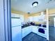 The kitchen features white cabinets, granite countertops, and modern appliances at 4016 Calle Paula, Las Vegas, NV 89103