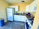 Efficient kitchen features white cabinets, granite countertops, and modern appliances at 4016 Calle Paula, Las Vegas, NV 89103