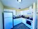 Efficient kitchen features updated cabinets, granite counters, and modern appliances at 4016 Calle Paula, Las Vegas, NV 89103