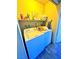 Dedicated laundry room featuring side-by-side washer and dryer with overhead shelving at 4016 Calle Paula, Las Vegas, NV 89103