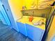 Bright laundry room featuring full-size washer and dryer and shelving at 4016 Calle Paula, Las Vegas, NV 89103