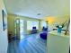 Inviting living room featuring wood floors, modern decor, and ample natural light at 4016 Calle Paula, Las Vegas, NV 89103